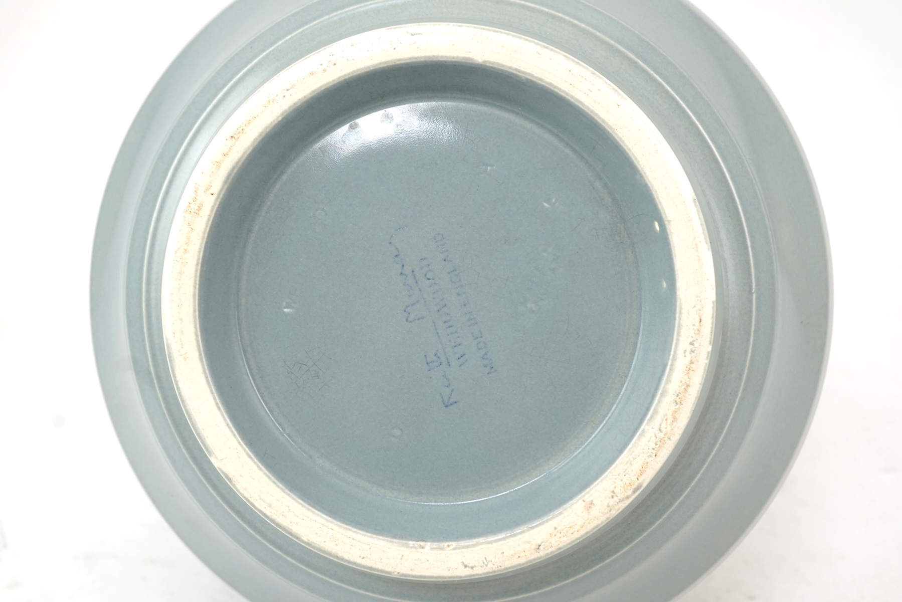 Keith Murray MC RDI FRIBA (New Zealand/British, 1892-1981) for Wedgwood: A pale blue glazed globe or 'bomb' vase